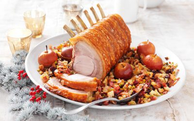 Crackled pork rack with tray roasted bacon, pistachio & raisin stuffing