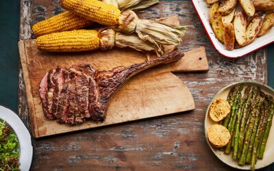 Tomahawk steak with potatoes, corn and asparagus